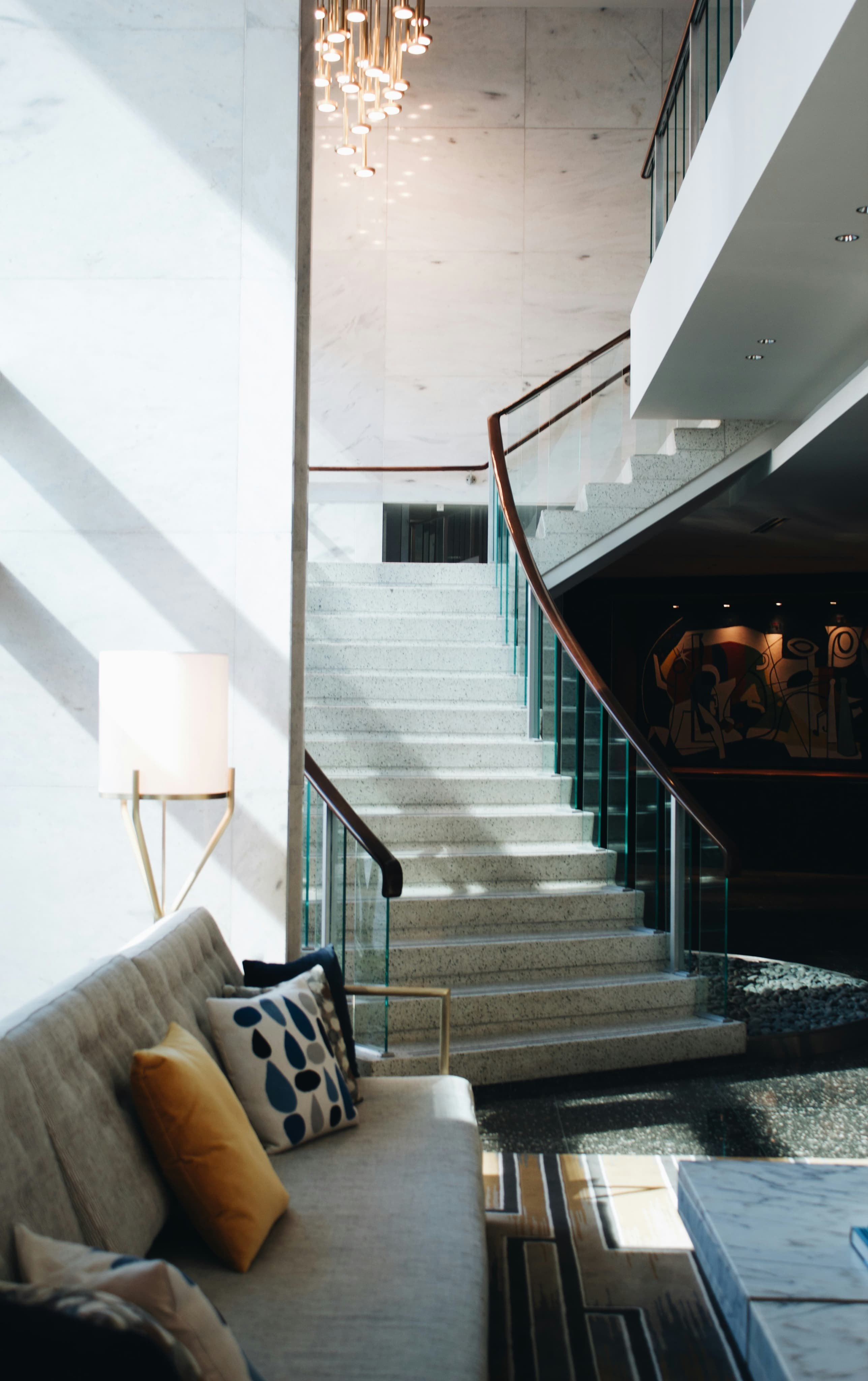 Modern interior staircase with chandelier